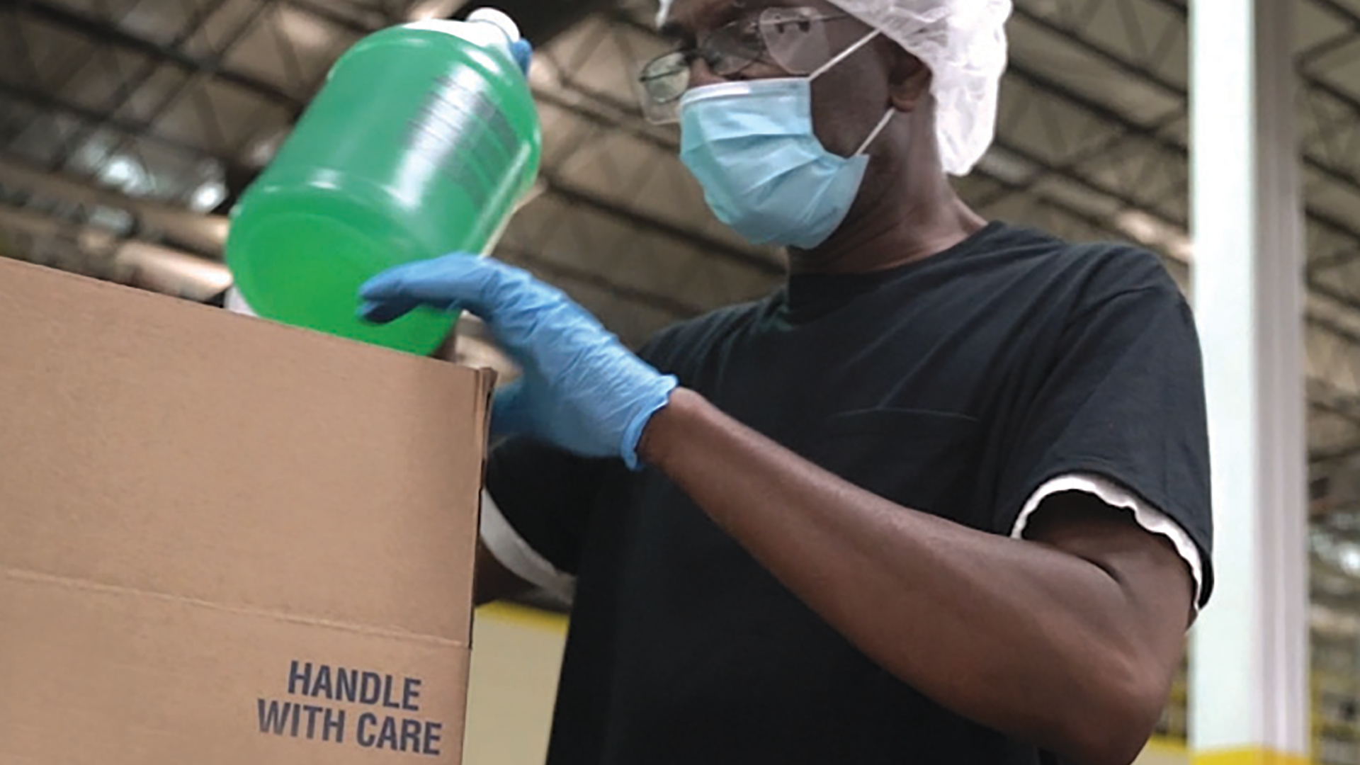 Worker packing jug w green.crop.RET